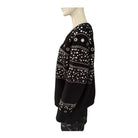 Black top with white embellishments on a mannequin against a white background