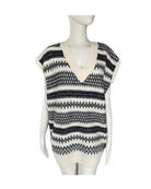Black and white patterned sleeveless top on a mannequin against a white background