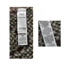 Close-up of a M&S label on fabric with text details.