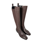 Pair of brown knee-high boots on a white background