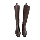 Pair of brown knee-high boots on a white background