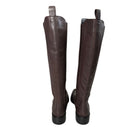 Pair of brown knee-high boots on a white background