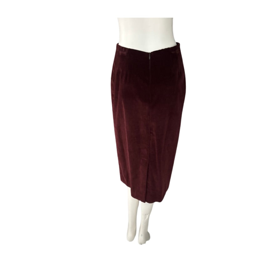 Burgundy skirt on a mannequin against a white background