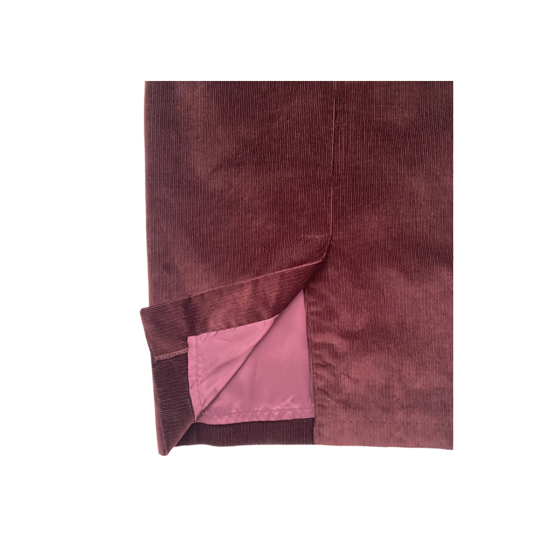 Folded burgundy back skirt split with pink lining on a white background