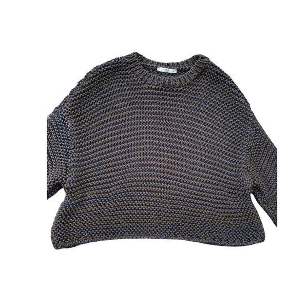 Knitted sweater with cut-out shoulders on a white background