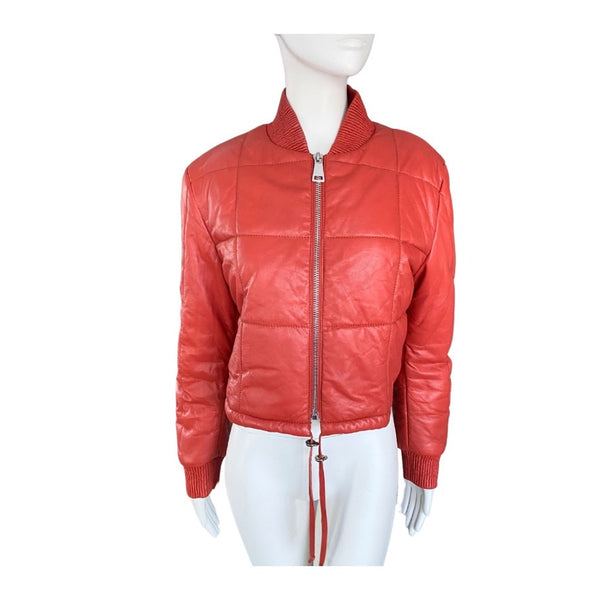 Orange leather jacket on a mannequin against a white background