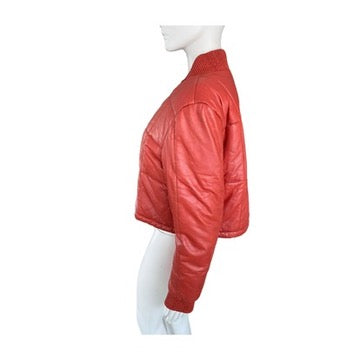 Orange leather jacket on a mannequin against a white background