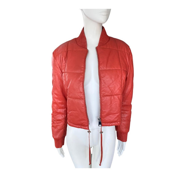 Orange leather jacket on a mannequin against a white background