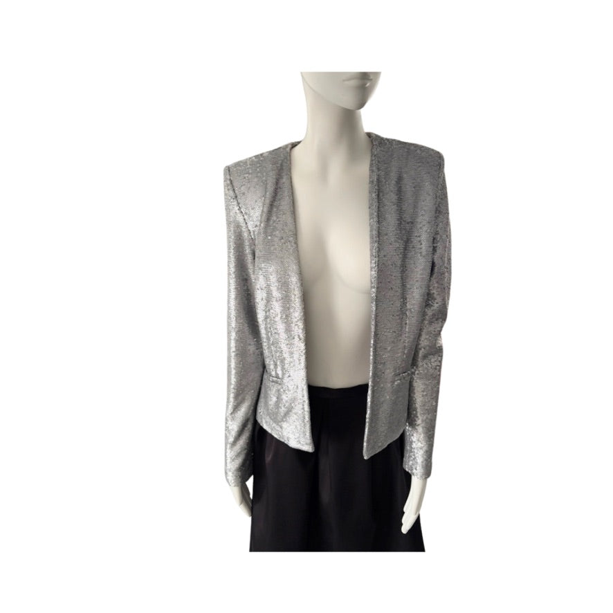 Mannequin wearing a gray open-front cardigan over a black top on a white background