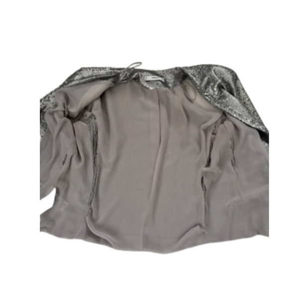 Grey jacket lining with silver sequin details on a white background
