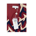 Patterned garment with a brand tag on a white background