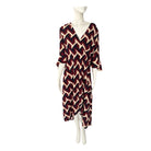 Mannequin wearing a patterned dress on a white background