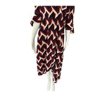 Mannequin wearing a dress with a zigzag pattern on a white background