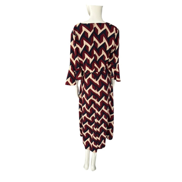 Mannequin wearing a dress with a zigzag pattern on a white background