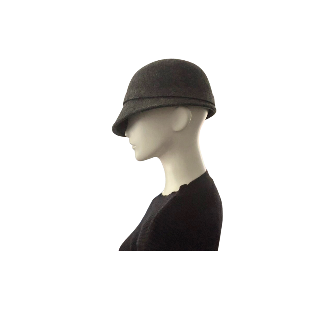 Grey cloche hat on a mannequin head against a white background