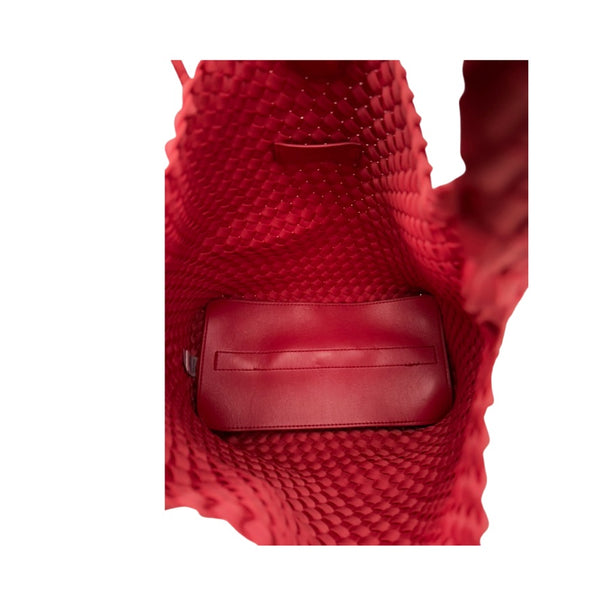 Red textured bag with a visible brand logo on a white background