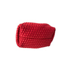 Red woven clutch bag on a white background