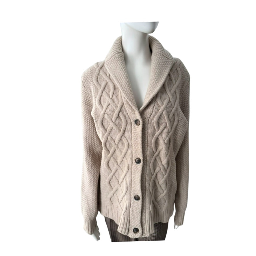 Beige cable knit cardigan on a mannequin against a white background