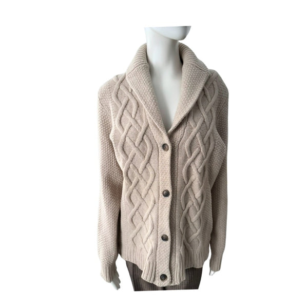 Beige cable knit cardigan on a mannequin against a white background