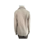 Beige sweater on a mannequin against a white background