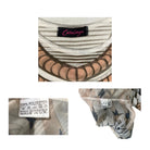 Close-up of a patterned fabric with a label and texture details.