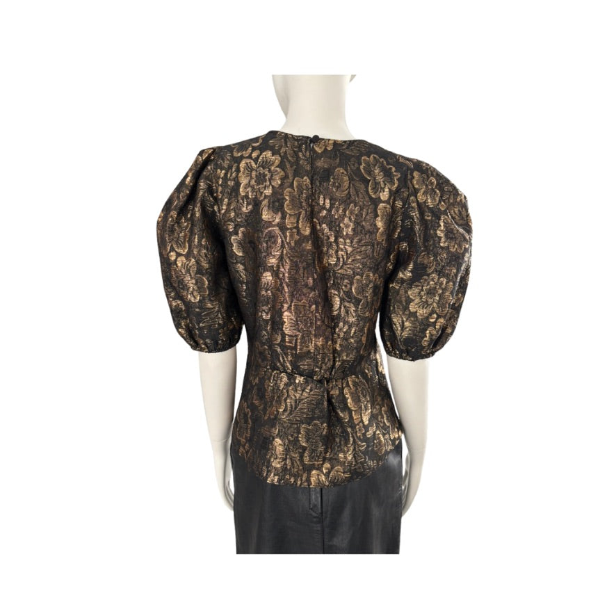 Black brocade top on a mannequin against a white background