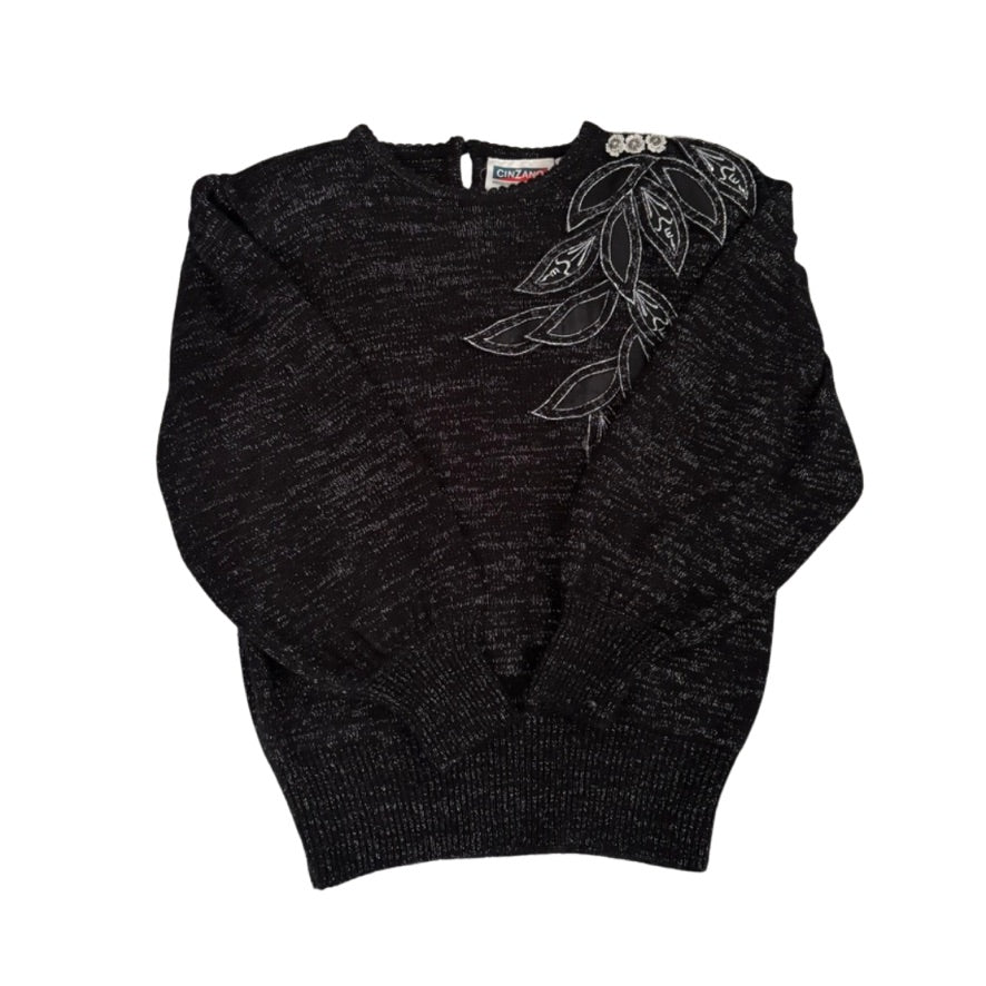 Dark grey sweater with floral embroidery on a white background