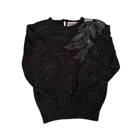 Dark grey sweater with floral embroidery on a white background