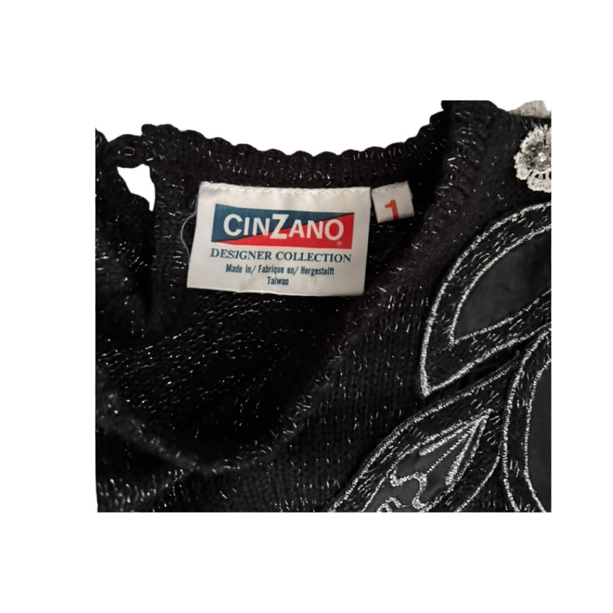 Dark Grey embroidered garment with a Cinzano label on a white background