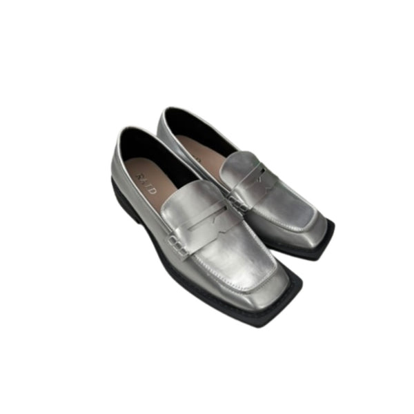 Pair of silver loafers on a white background