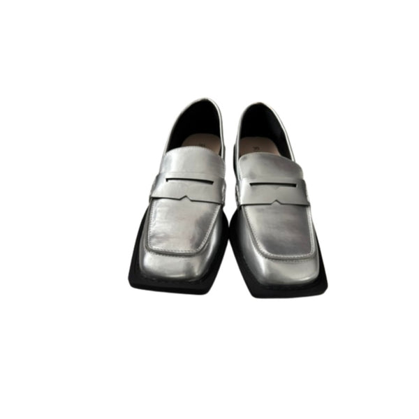 Pair of silver loafers on a white background