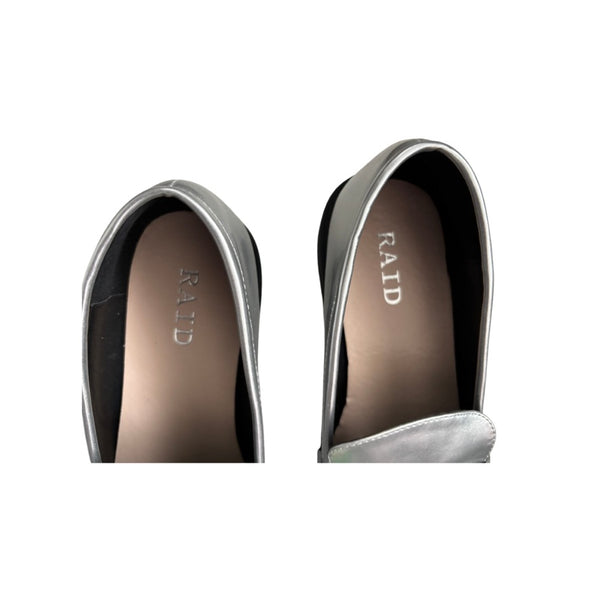 Close-up of a pair of shoes with 'RAID' branding on a white background