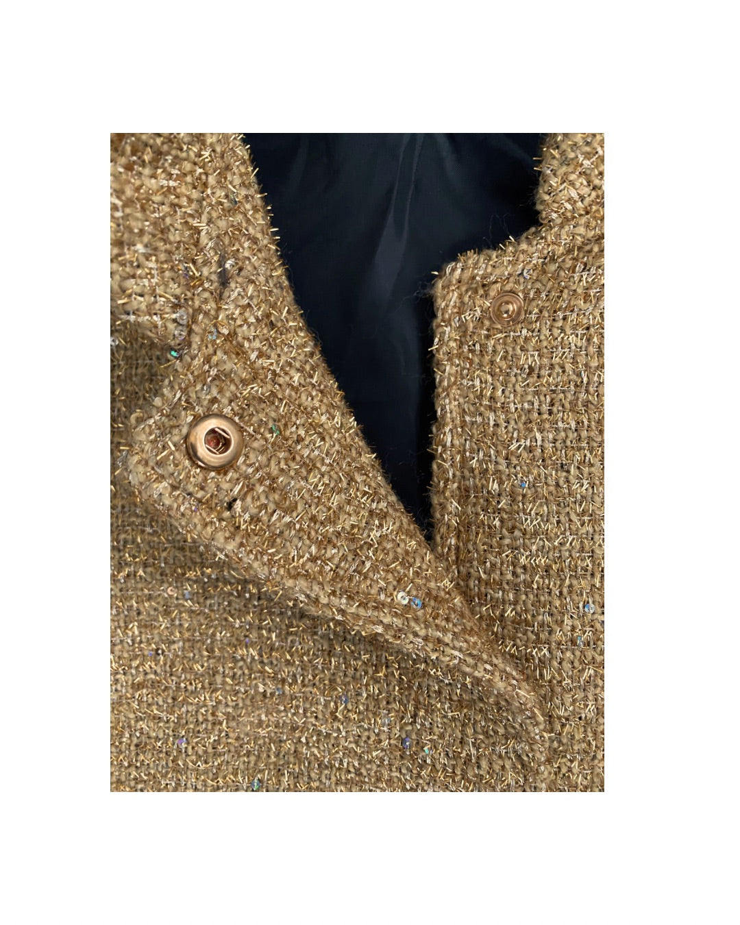 Close-up of a textured fabric with a button on a white background