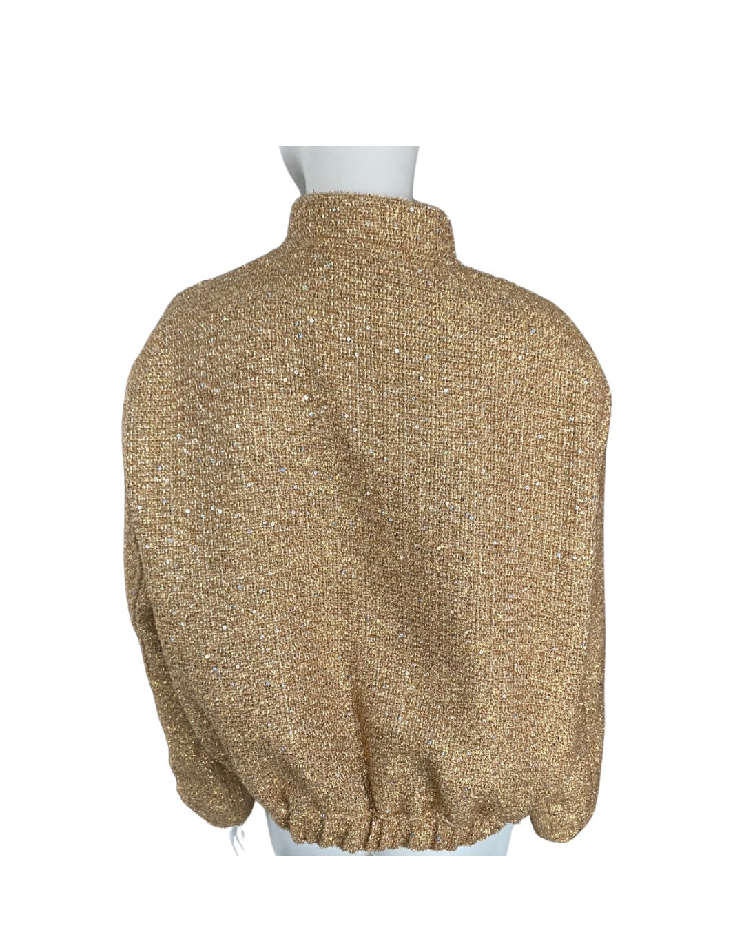 Gold Jacket on a mannequin against a white background