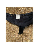 size label on a textured gold background