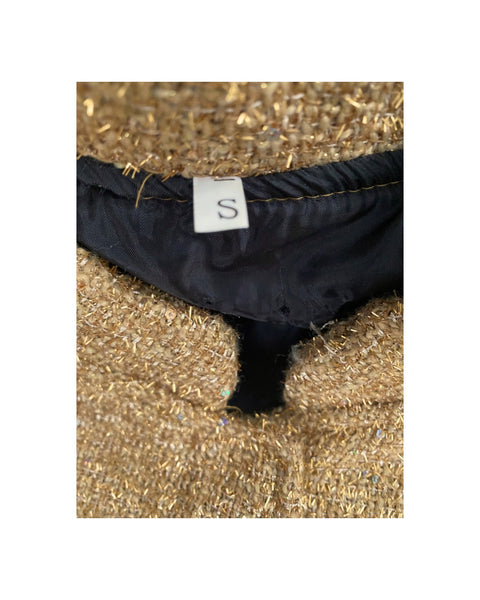 size label on a textured gold background