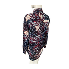 Multicolored patterned blouse on a mannequin against a white background