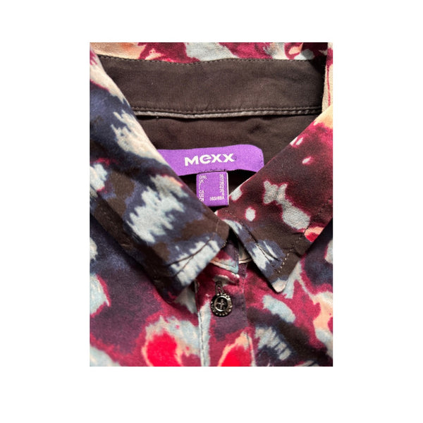 Close-up of a colorful shirt with a visible 'MEXX' label on a white background