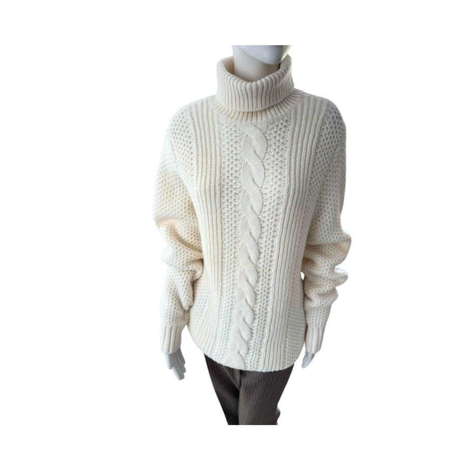 White cable knit sweater on a mannequin against a white background