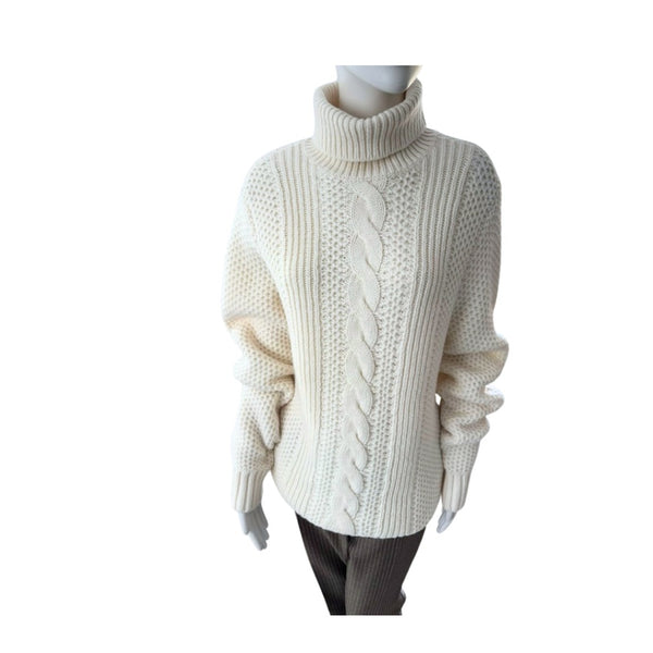 White cable knit sweater on a mannequin against a white background
