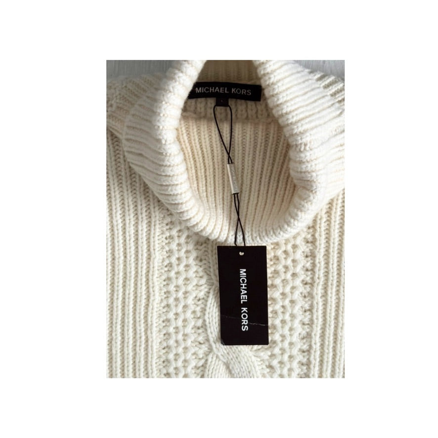 White knit sweater with a visible Michael Kors tag on a white background