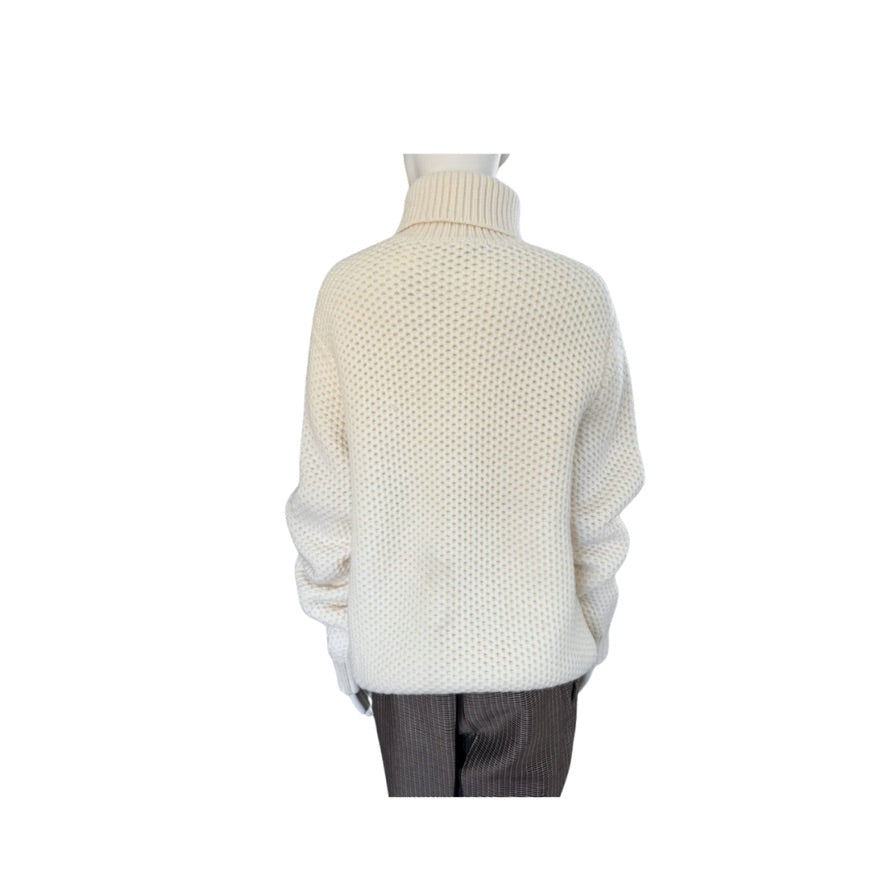 White knit sweater on a mannequin against a white background