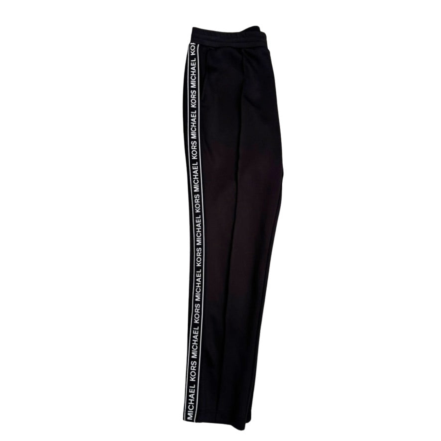 Black pants with 'Michael Kors' branding on a white background