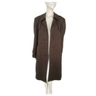 Brown coat on a mannequin against a white background