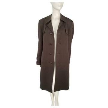 Brown coat on a mannequin against a white background