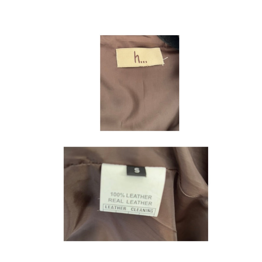 Brown leather jacket with a brand tag and a label indicating 100% leather.