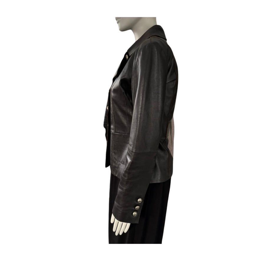 Mannequin wearing a brown leather jacket on a white background