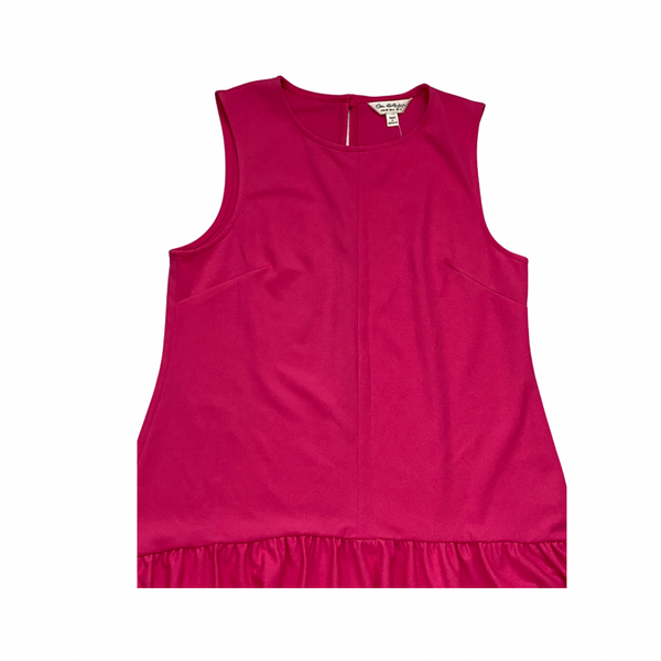 Pink sleeveless top on a white background
