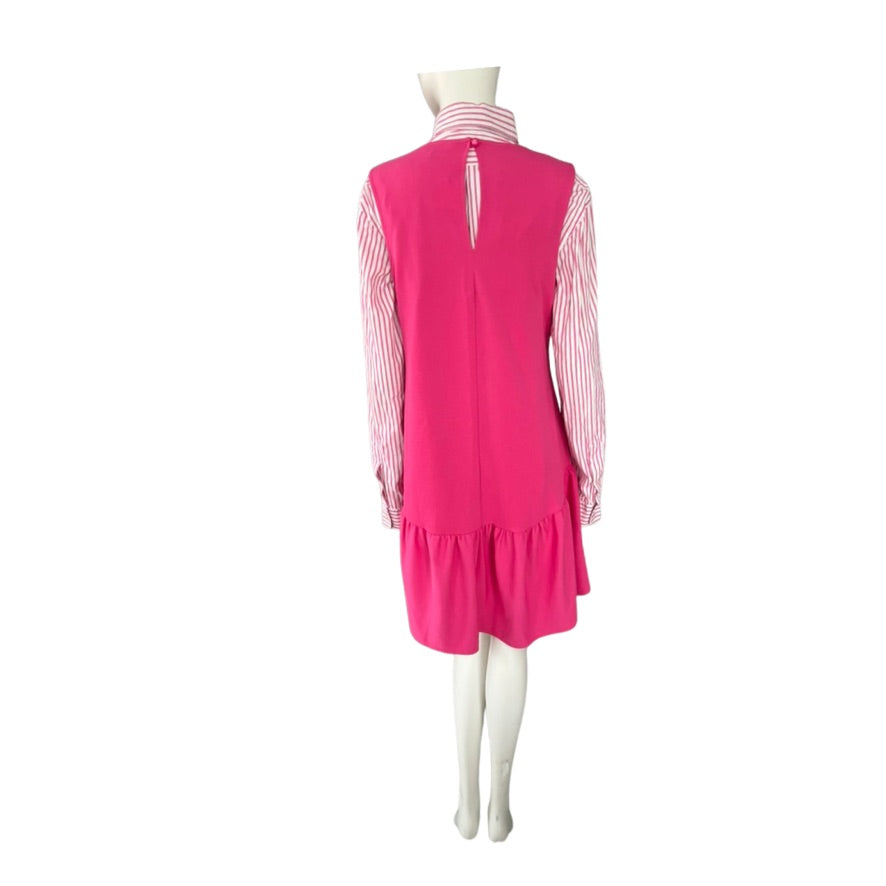 Mannequin wearing a pink dress with a white background