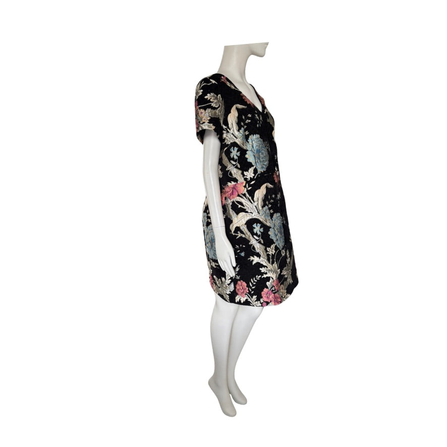 Floral dress on a mannequin against a white background